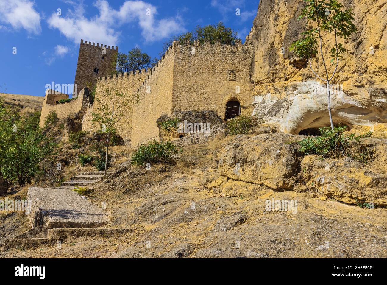 Standing next to the walls of the Yedra castle rising up above the town of Cazorla Stock Photo