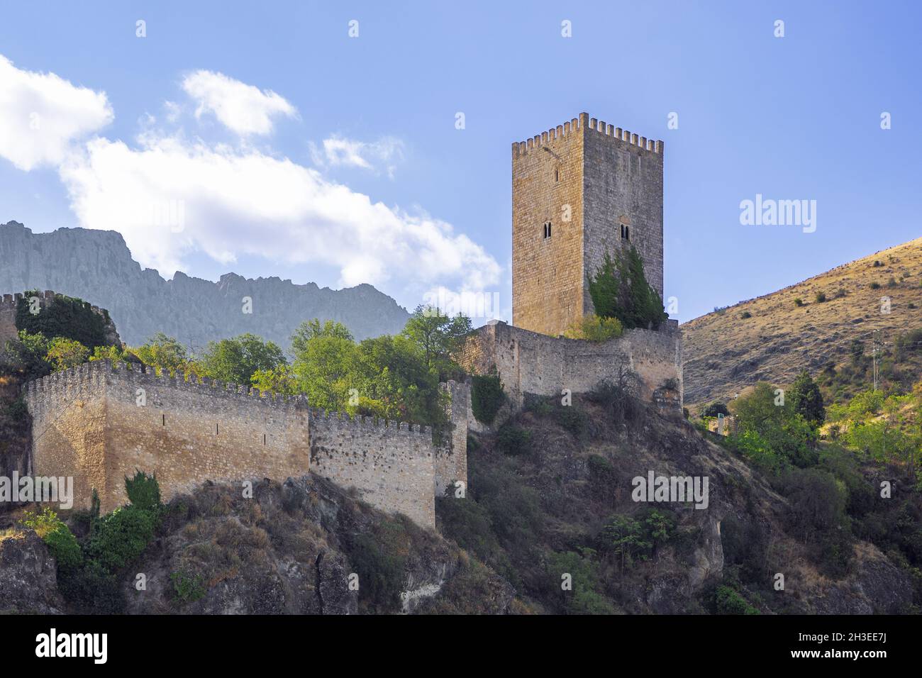 Close up of the Yedra castle rising up above the town of Cazorla Stock Photo