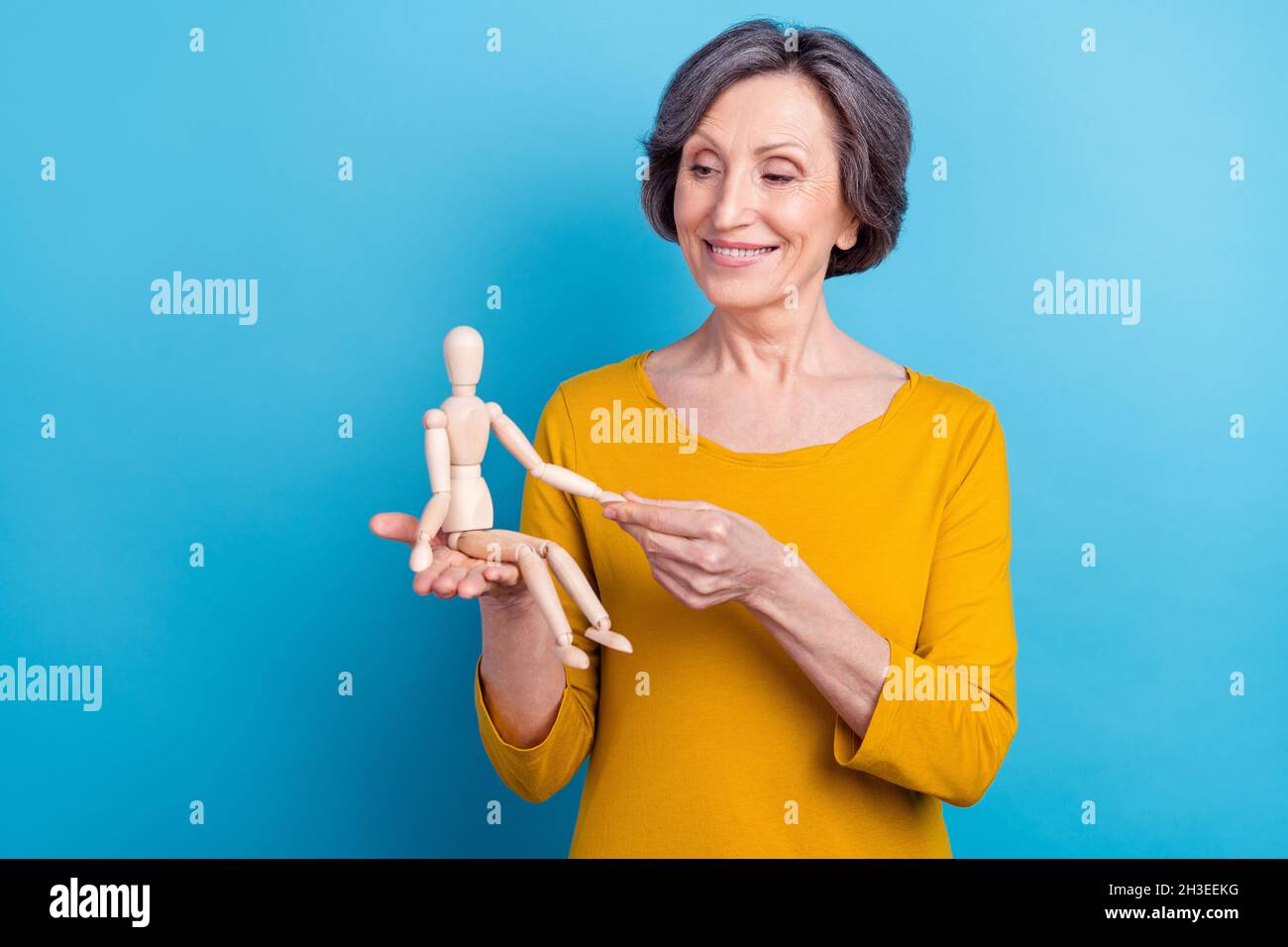 smiling female puppeteer holding male marionette isolated on grey Stock  Photo - Alamy