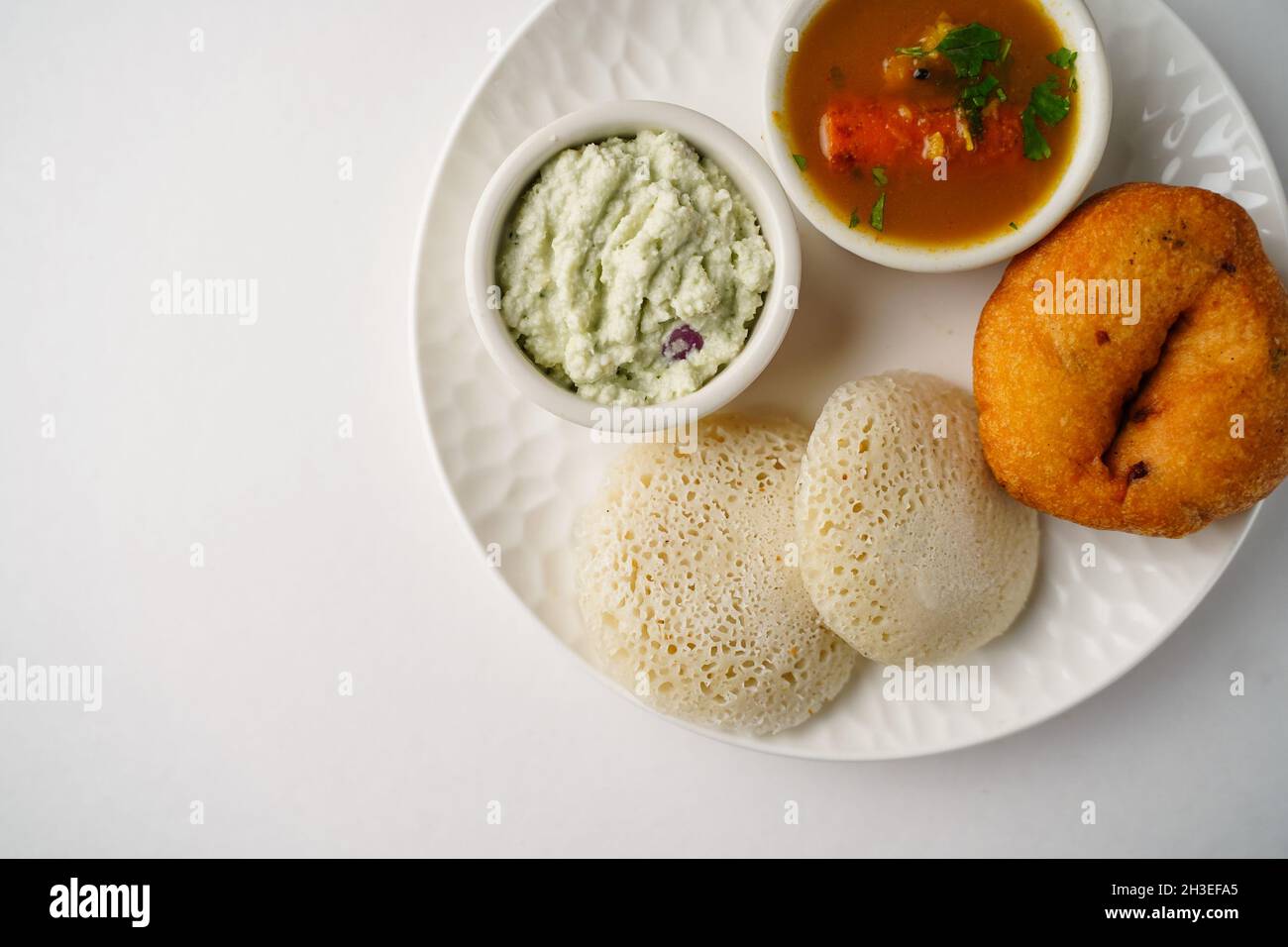 Idli Vada sambar chutney isolated on white South Indian vegetarian