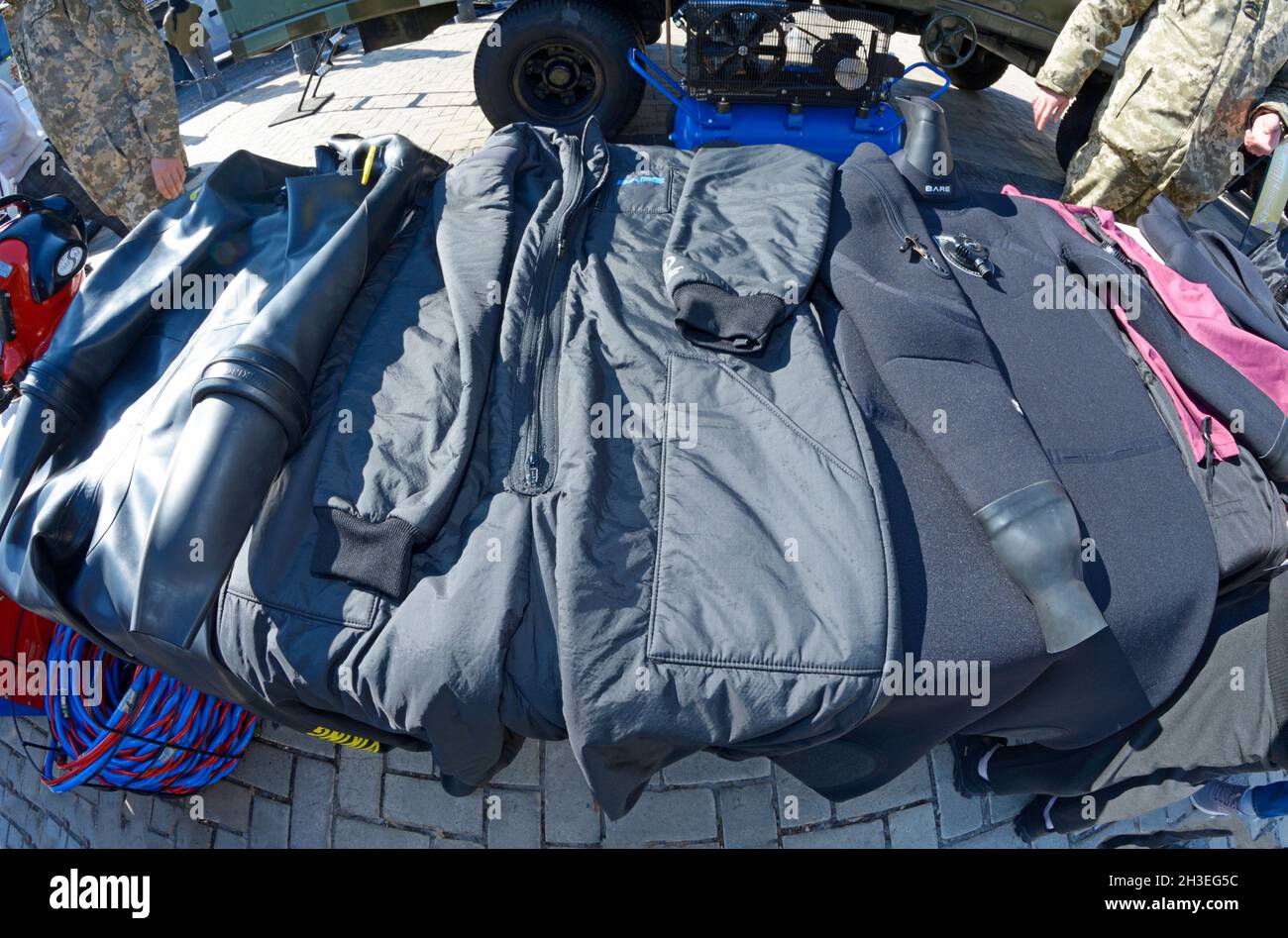 Diving suits, cold water wetsuits placed on stand. October 15, 2021