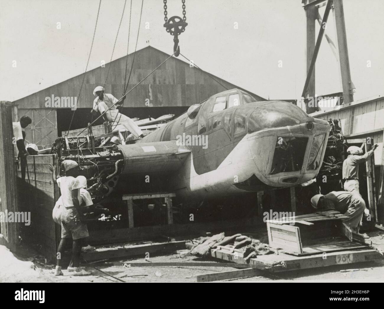 Vintage photo circa 1942 of a Bristol Blenheim light bomber of the RAF being unloaded from a crate prior to the Japanese invasion of Malaya and the fall of Singapore Stock Photo