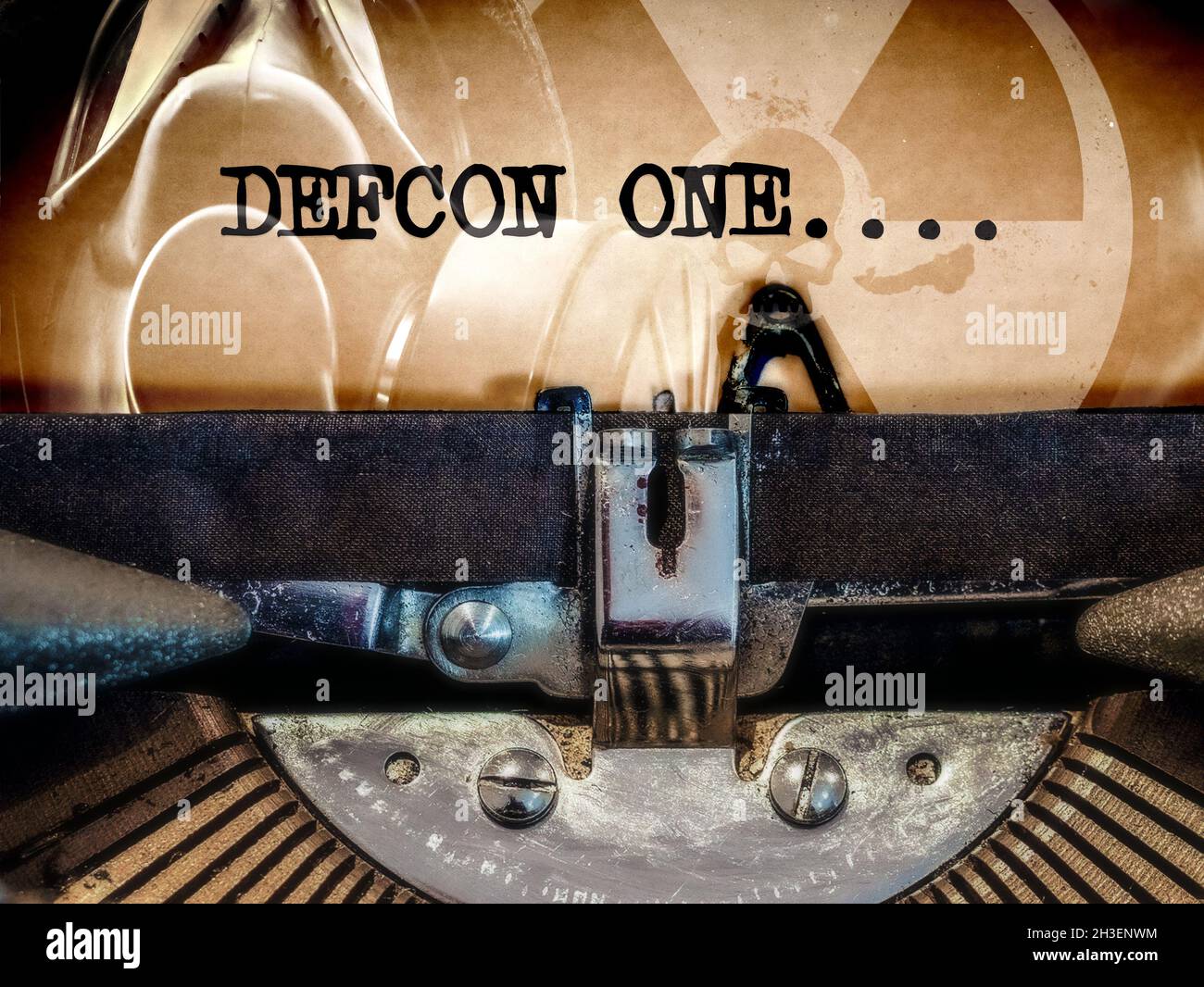 Classic Typewriter with DEFCON ONE displayed on an Apocalyptic background Stock Photo