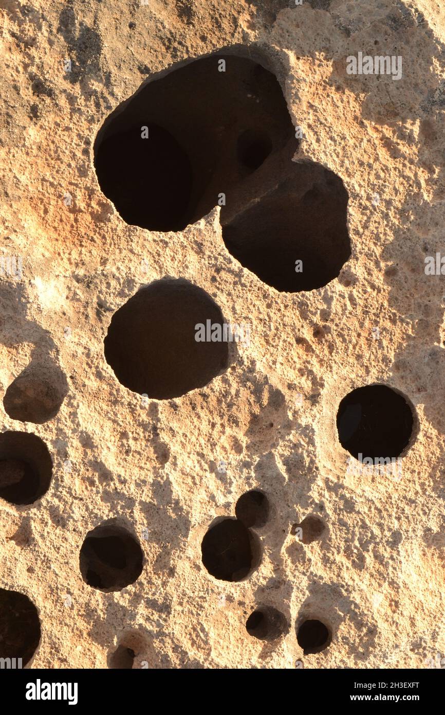 Holes in Rocks at Cala Blanca Stock Photo
