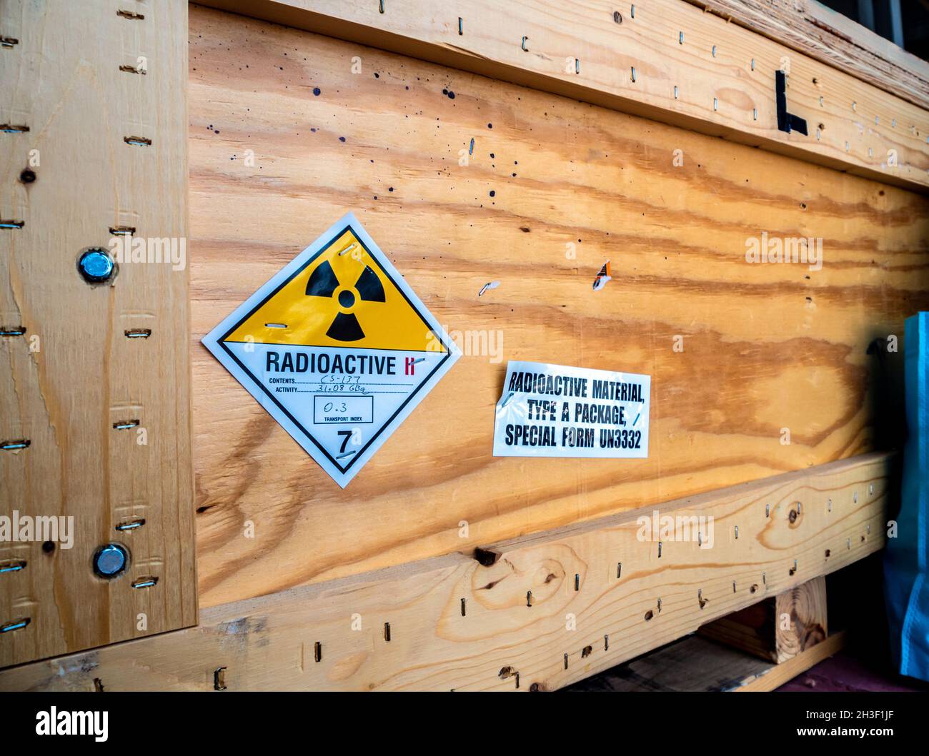 The radioactive material label beside the transportation wooden box