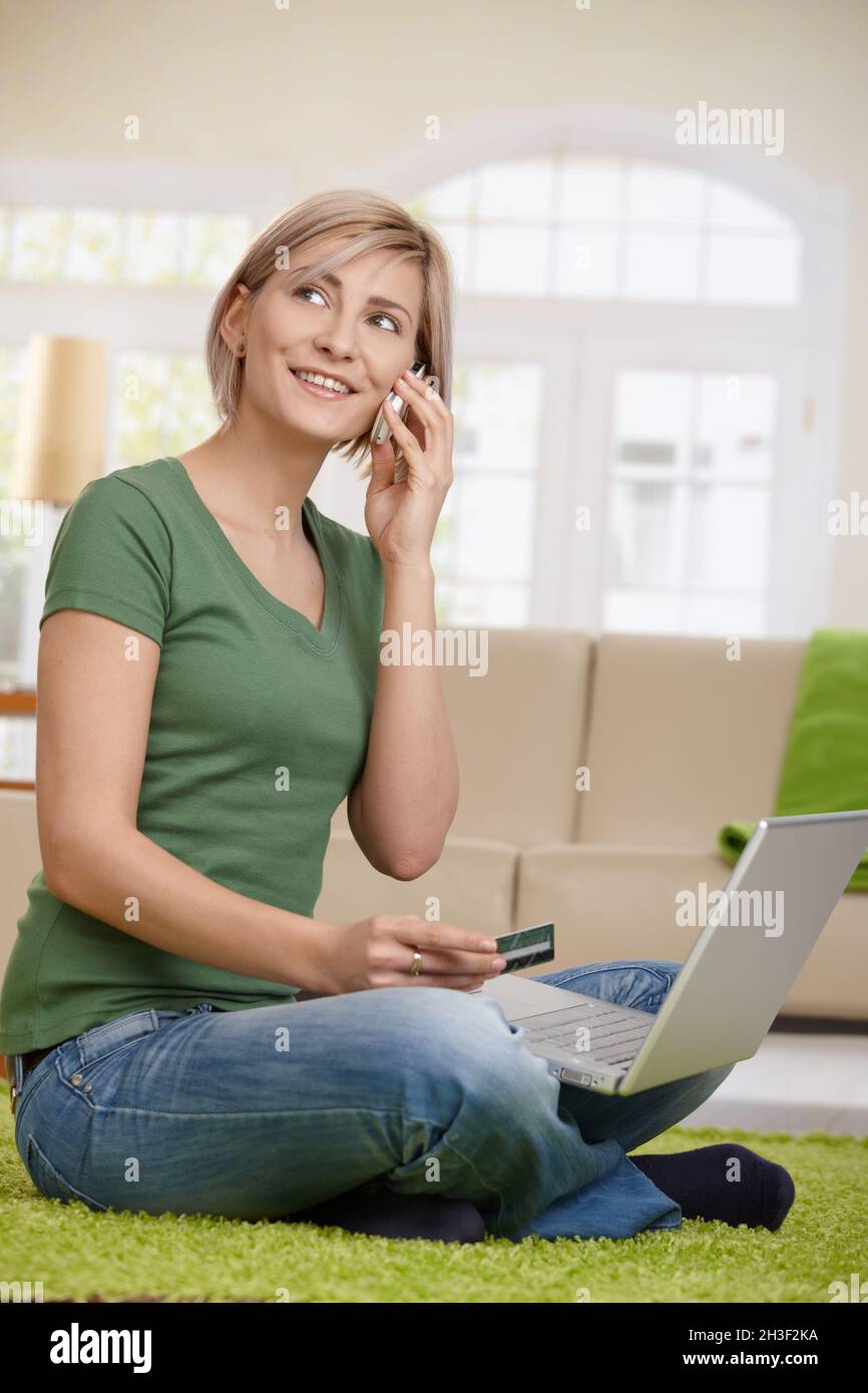 Woman arranging hotel reservation Stock Photo