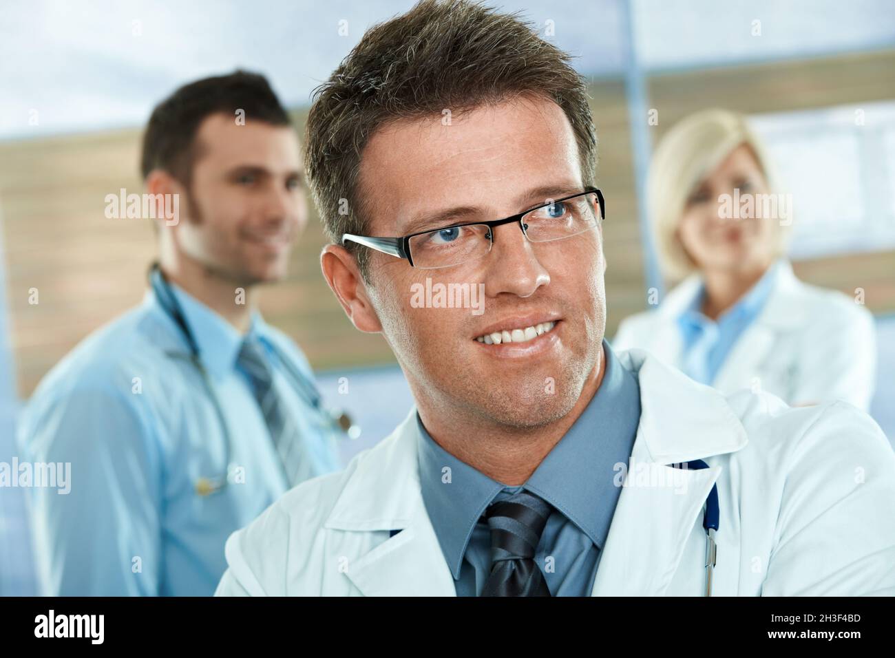 Photo confident handsome doctor hi-res stock photography and images - Alamy
