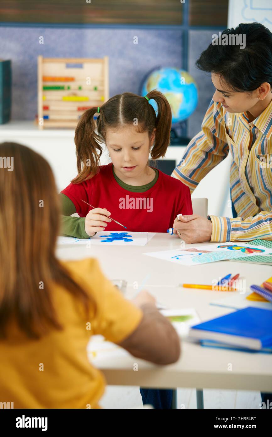 School children and teacher in art class Stock Photo - Alamy
