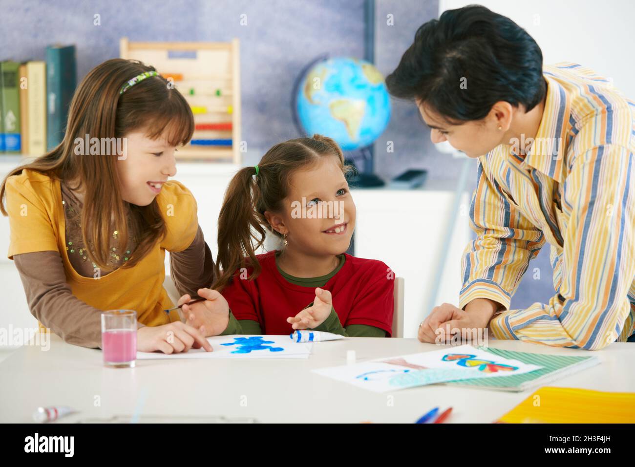 School children and teacher in art class Stock Photo - Alamy