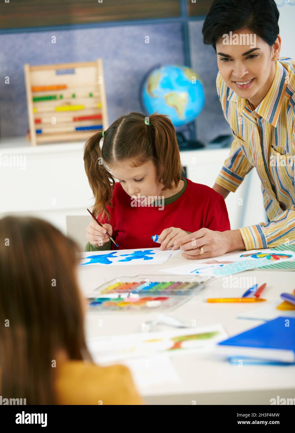School children and teacher in art class Stock Photo - Alamy