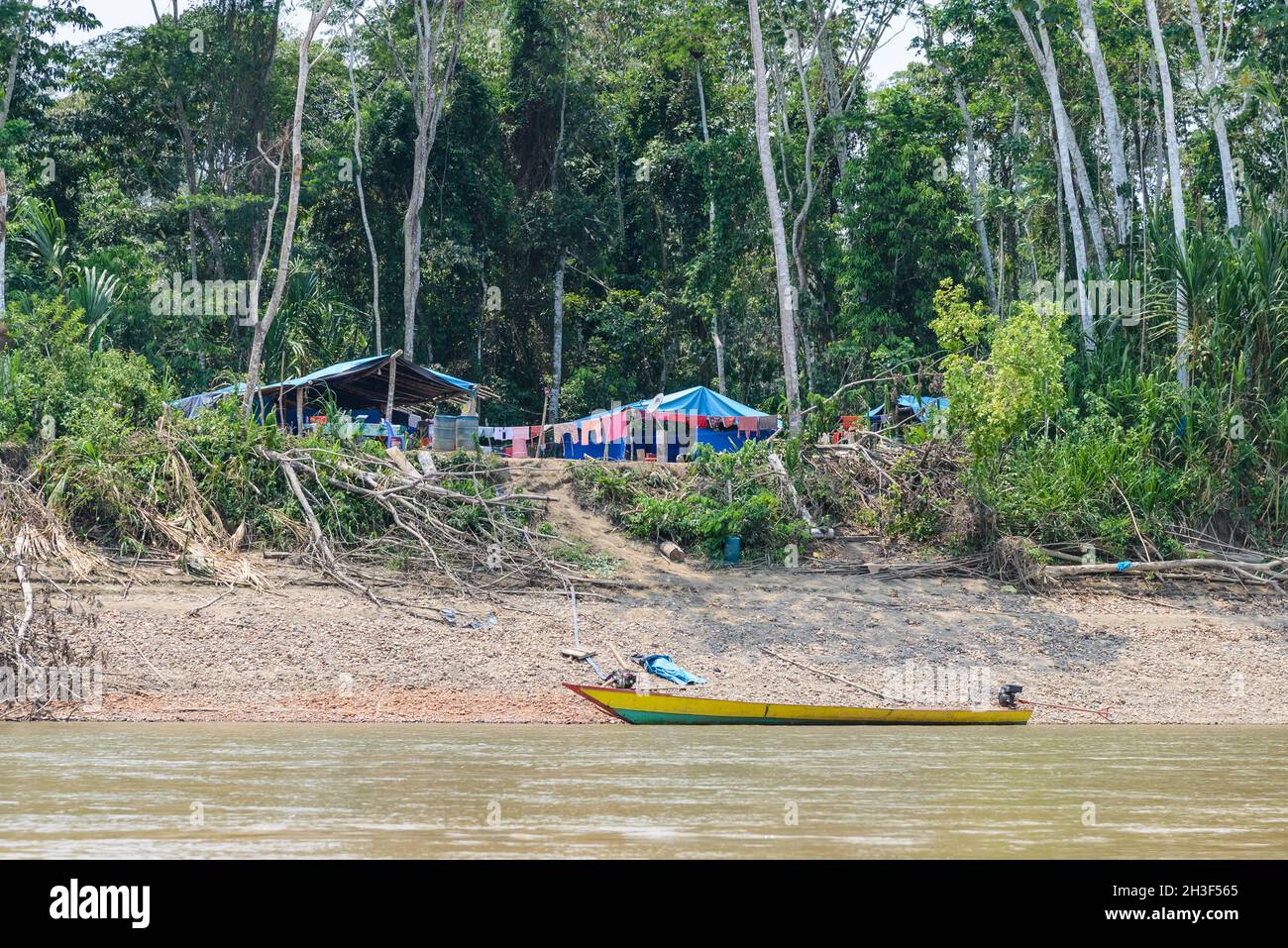 Mining camp from gold mining operation along Rio Madre de Dios in the Peruvian Amazon. Madre de Dios, Peru. Stock Photo