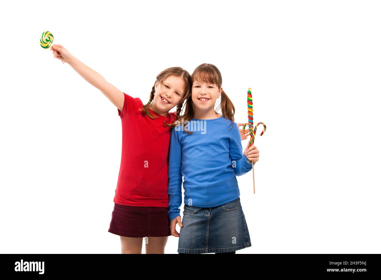 Smiling girls with lollipop Stock Photo