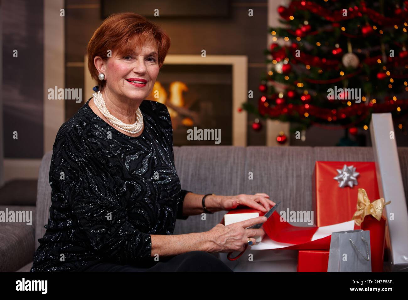 Smiling senior woman wrapping hi-res stock photography and images - Alamy