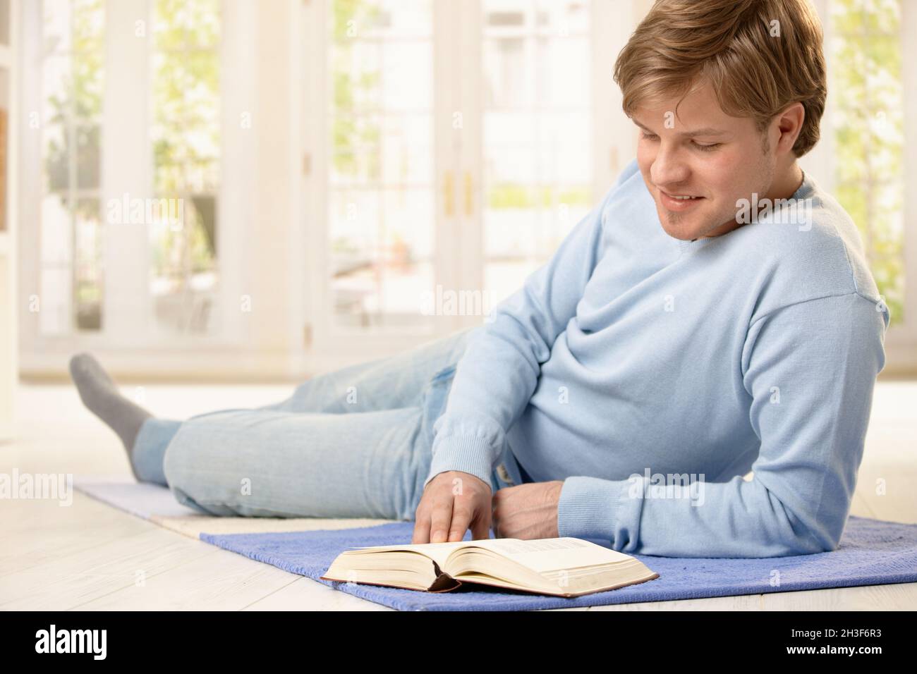 Man reading book Stock Photo