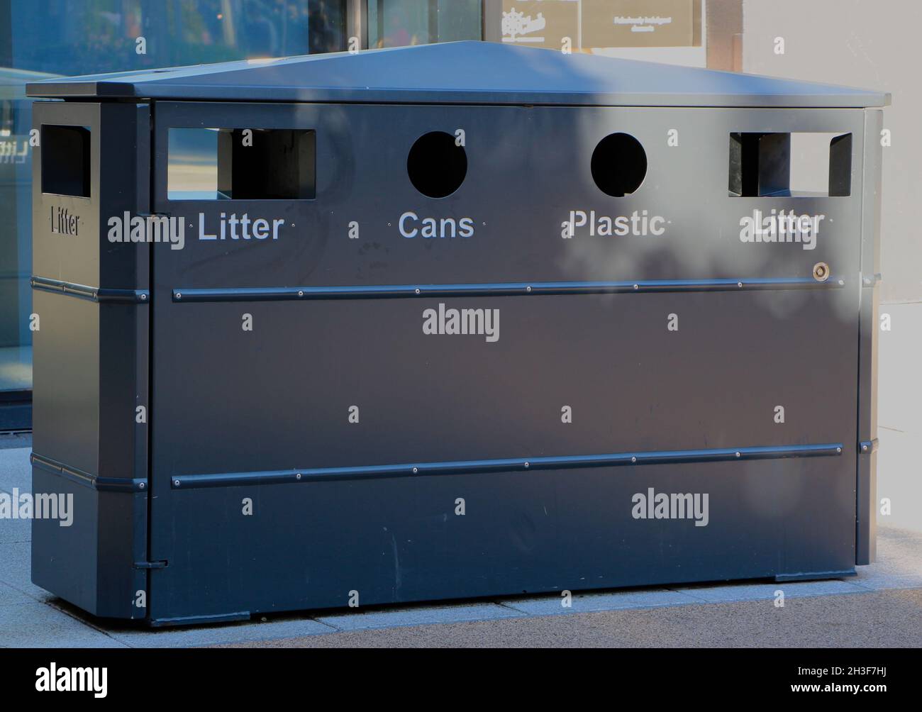 Public recycling litter cans and plastic rubbish bin in the