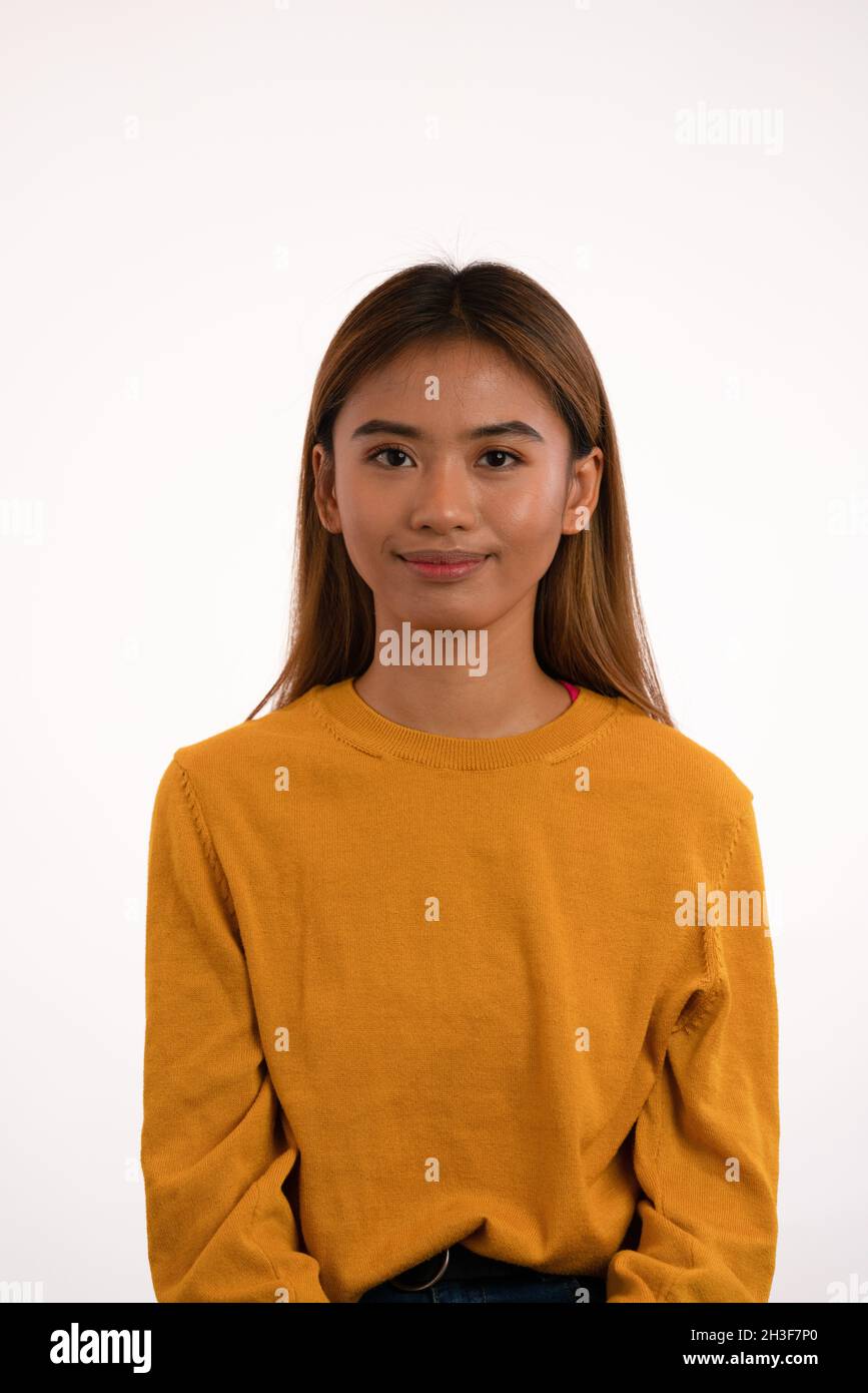 Young attractive asian girl smiling in studio Stock Photo