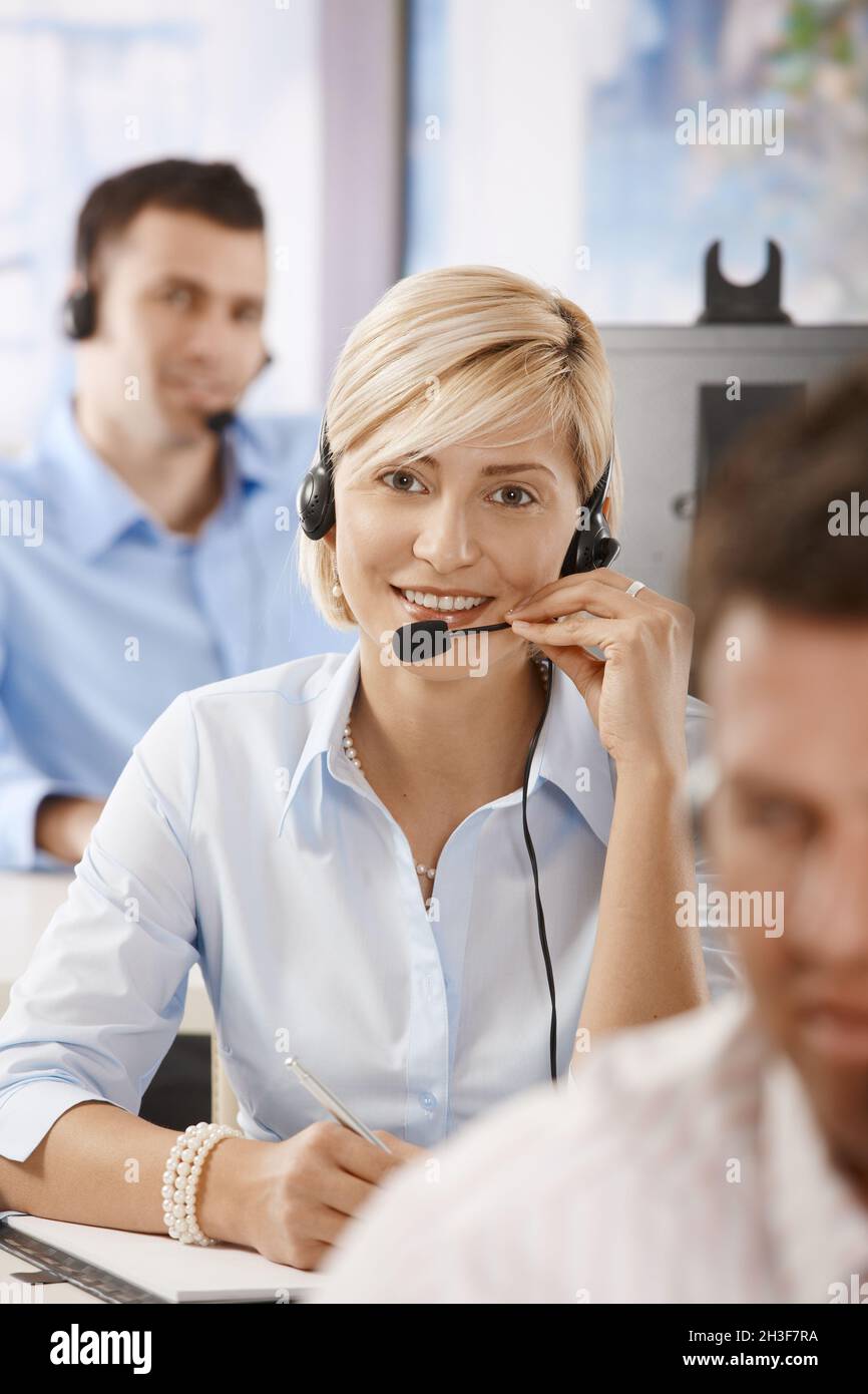 Operator talking on headset Stock Photo - Alamy
