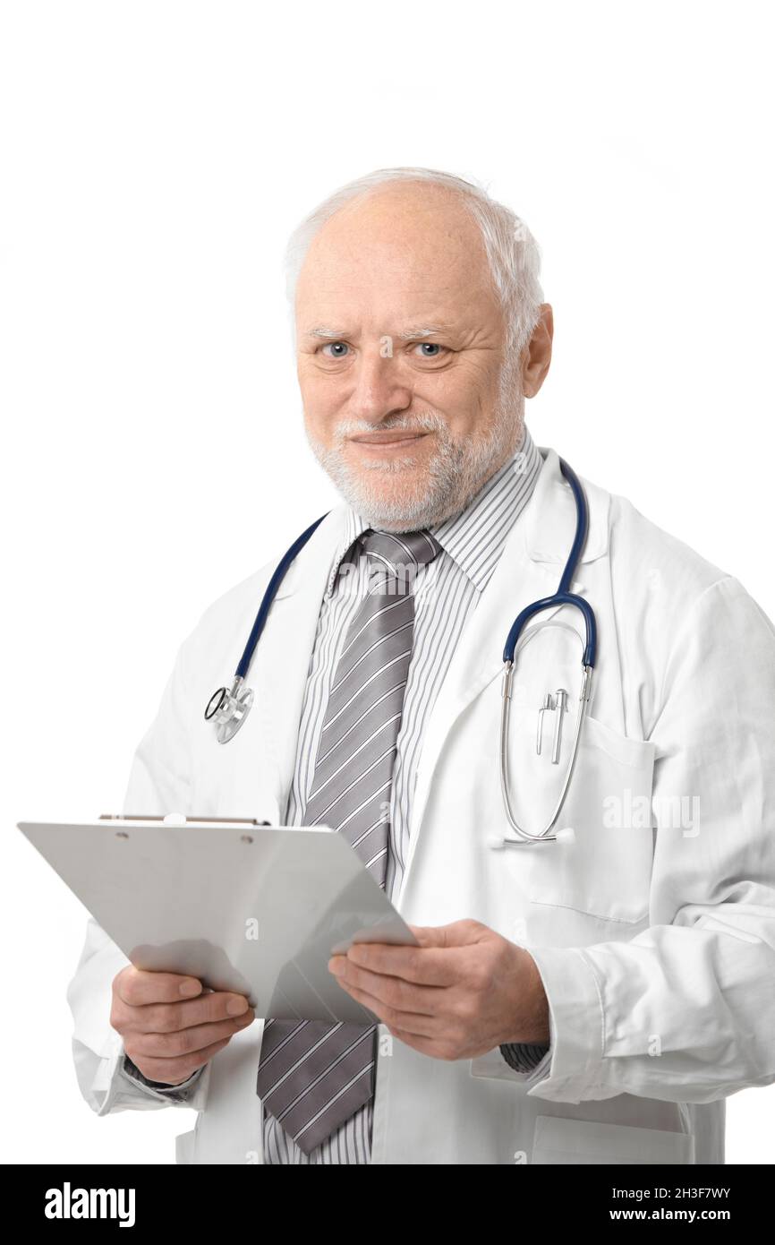 Senior doctor holding papers smiling Stock Photo - Alamy