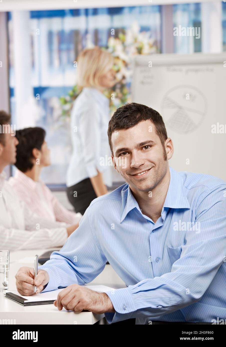 Businessman making notes on meeting Stock Photo