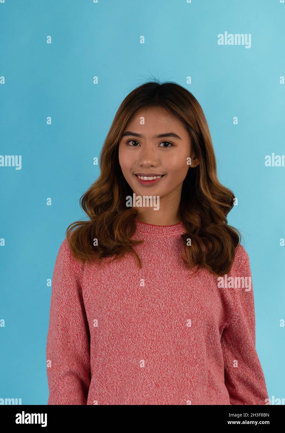 Young attractive happy asian girl in studio Stock Photo