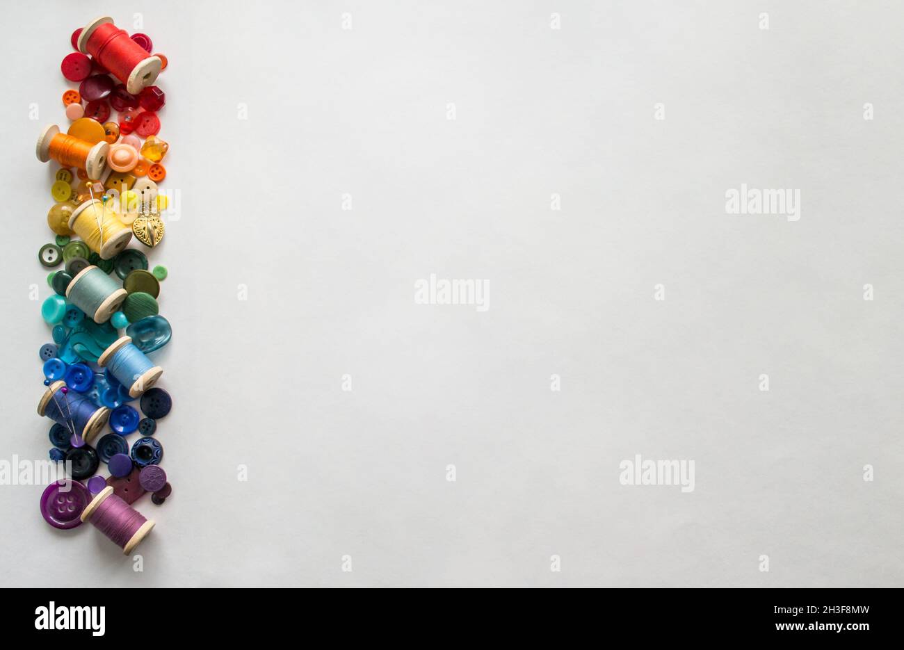 Heap of multi-coloured sewing pins on a white background, Stock image