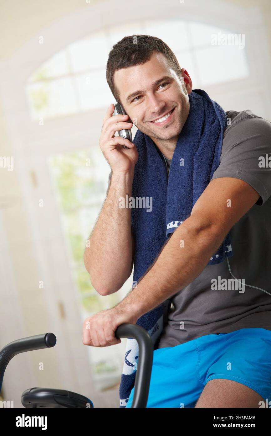 Man talking on mobile after training Stock Photo