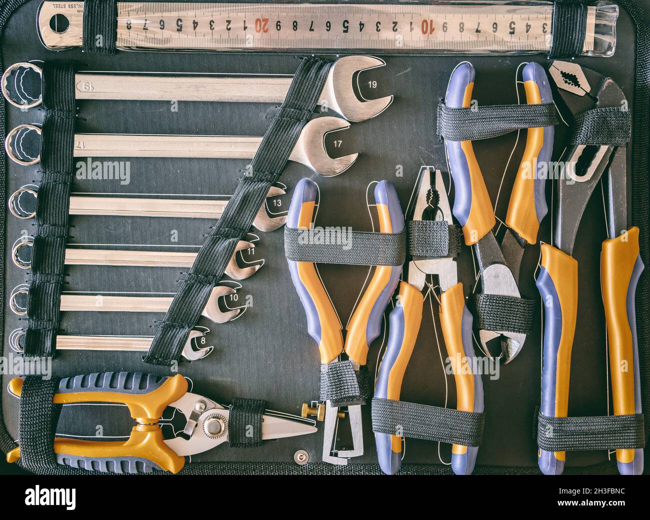 Wrench, pliers and spanners set in a toolbox. Home repair tools set ...