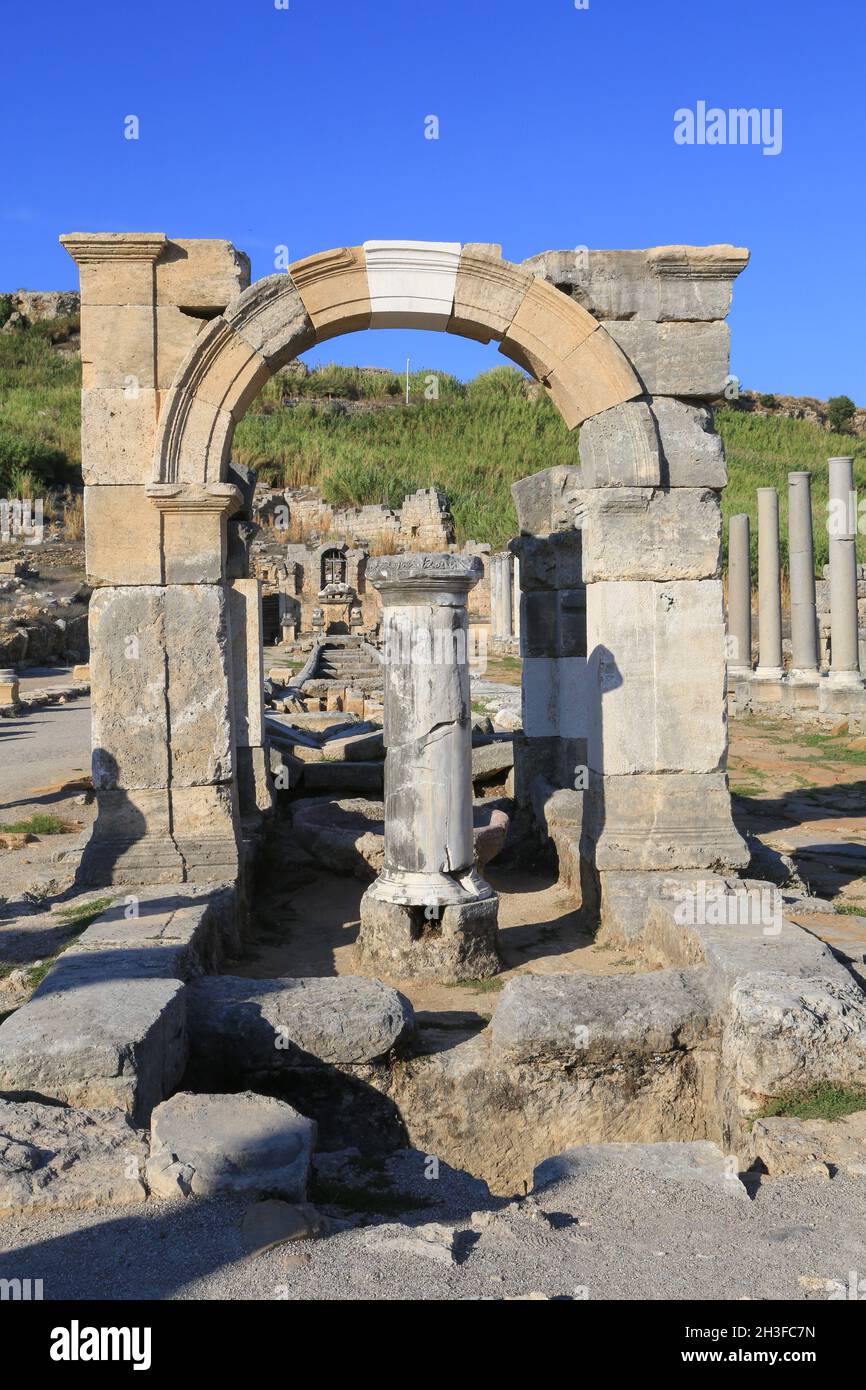 Reconstructed arch over the water canal, built during the Roman period, at the ancient Greek city of Perge (Perga) in the Anatolia region of Turkey. Stock Photo