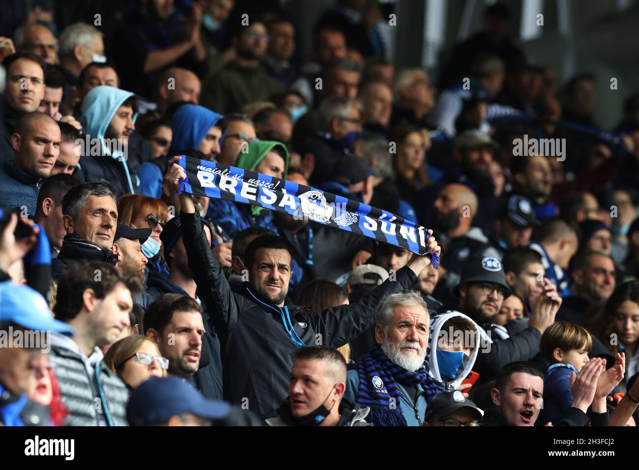 Bergamo, Italy, 24th October 2021. An Atalanta fan holds up a scarf mocking the natives of neighbouring region Brescia during the Serie A match at Gewiss Stadium, Bergamo. Picture credit should read: Jonathan Moscrop / Sportimage Stock Photo