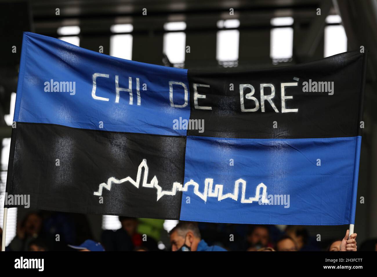 Bergamo, Italy, 24th October 2021. A fan holds up a banner in the colours of Atalanta depicting an outline of the city skyline during the Serie A match at Gewiss Stadium, Bergamo. Picture credit should read: Jonathan Moscrop / Sportimage Stock Photo