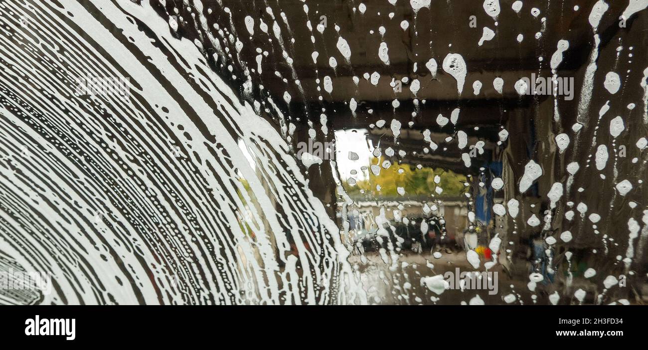 Winchester, Hampshire, UK. 2021. Drivers eye view of soap suds and