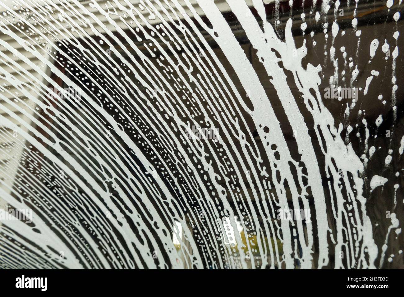 Winchester, Hampshire, UK. 2021. Drivers eye view of soap suds and