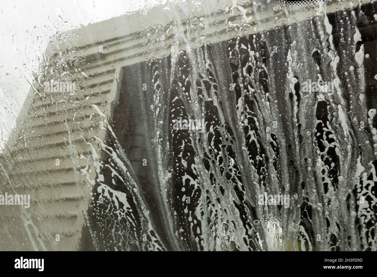 Winchester, Hampshire, UK. 2021. Drivers eye view of soap suds and