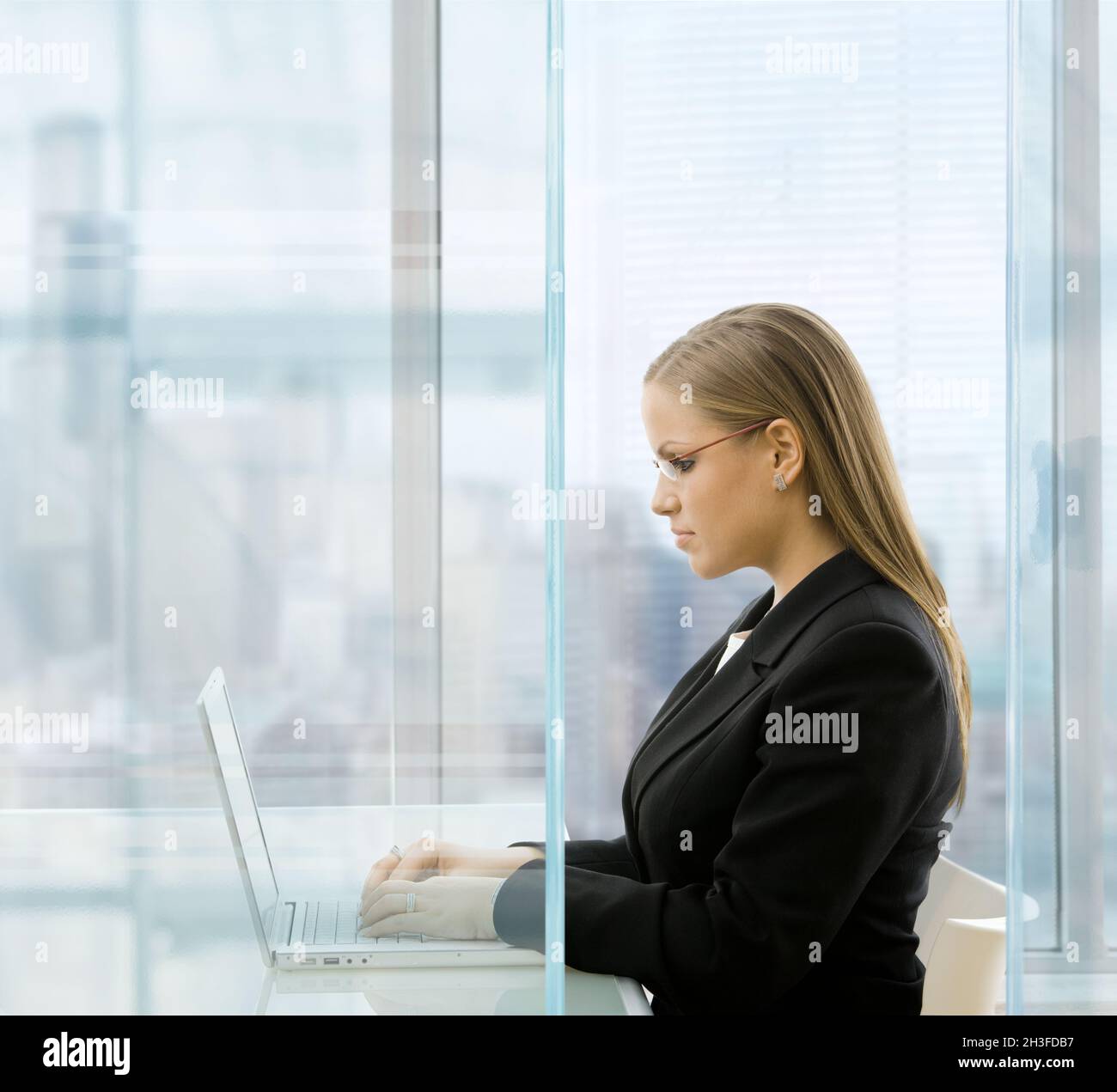 Businesswoman using laptop comouter Stock Photo