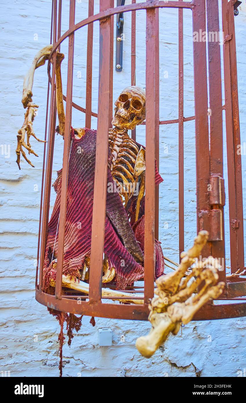 GRANADA, SPAIN - SEPT 27, 2019: The courtyard of Museum of Inquisition in Palacio de los Olvidados (Palace of the Forgotten) with a skeleton in the ca Stock Photo