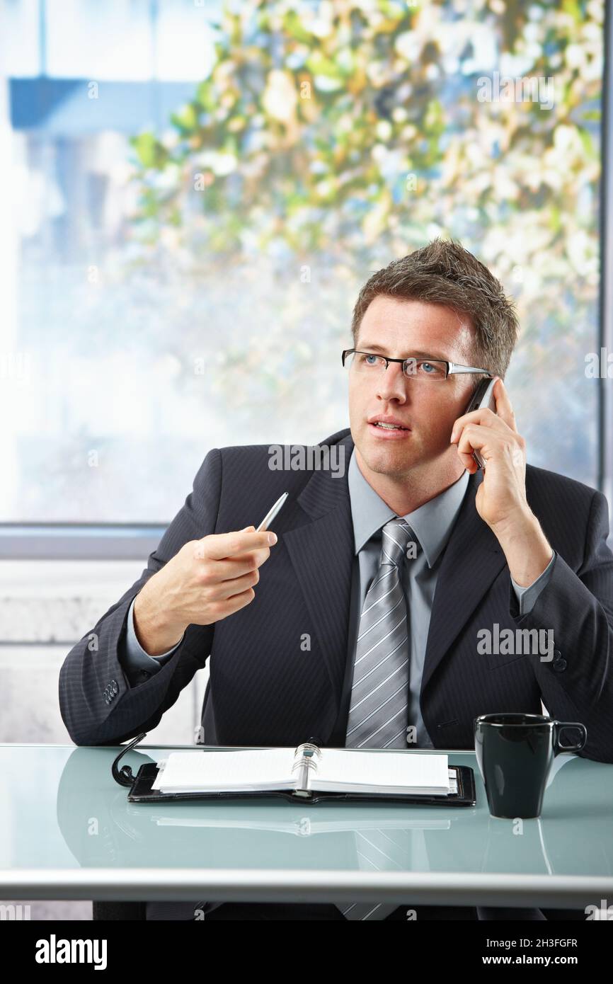 Prefessional Taking Notes Employee thinking and taking notes hi-res stock photography and images ...