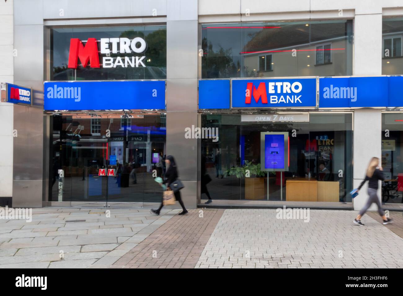 high Wycombe, England - October 22nd 2021: People walking past a Metro bank. The bank was formed in 2010. Stock Photo