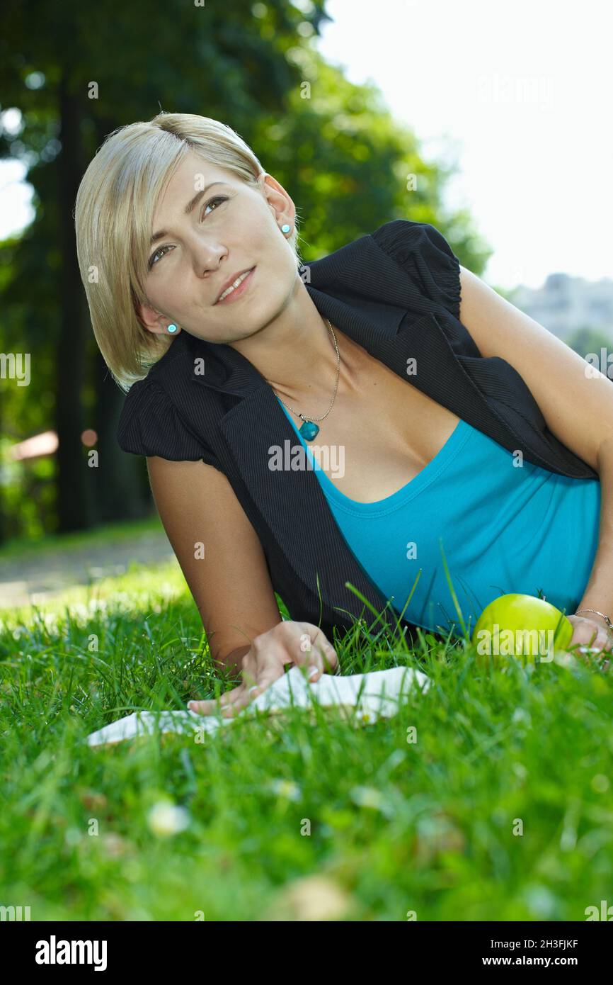 Woman reading book outdoor Stock Photo