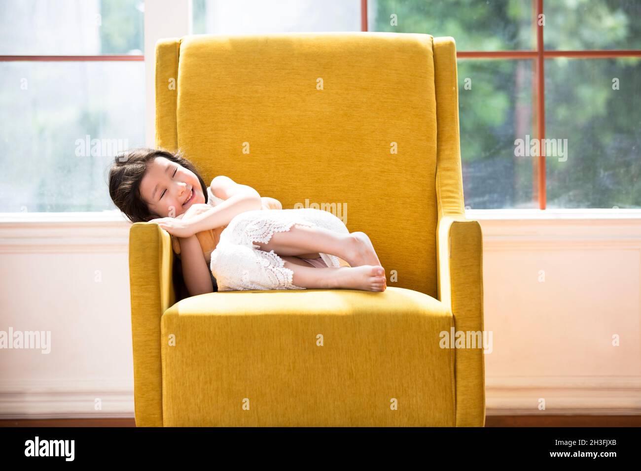 Lovely girl lying on the sofa Stock Photo - Alamy