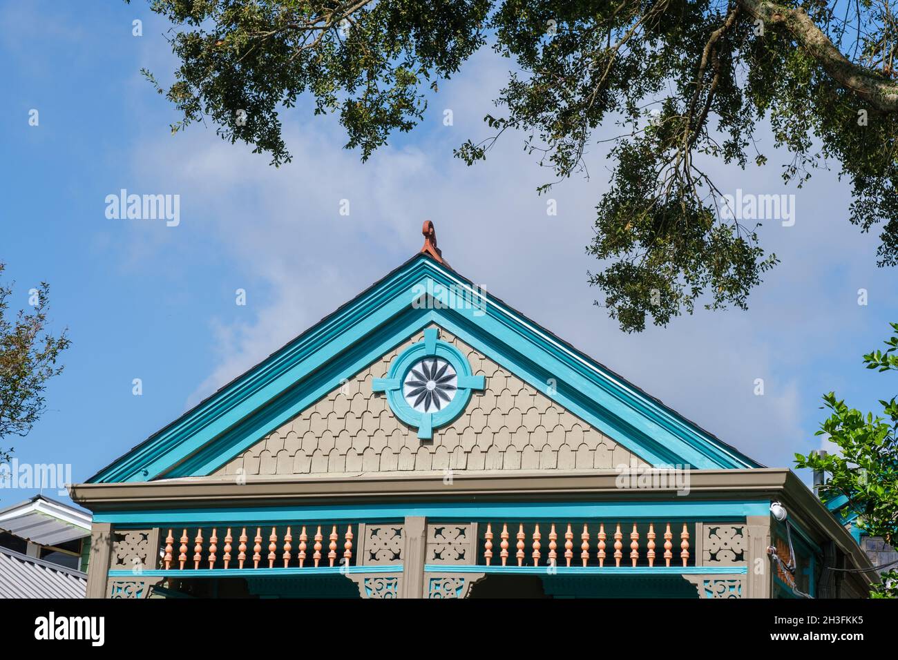 NEW ORLEANS, LA, USA - OCTOBER 25, 2021: Front gable of colorfully painted shotgun house in Uptown New Orleans Stock Photo