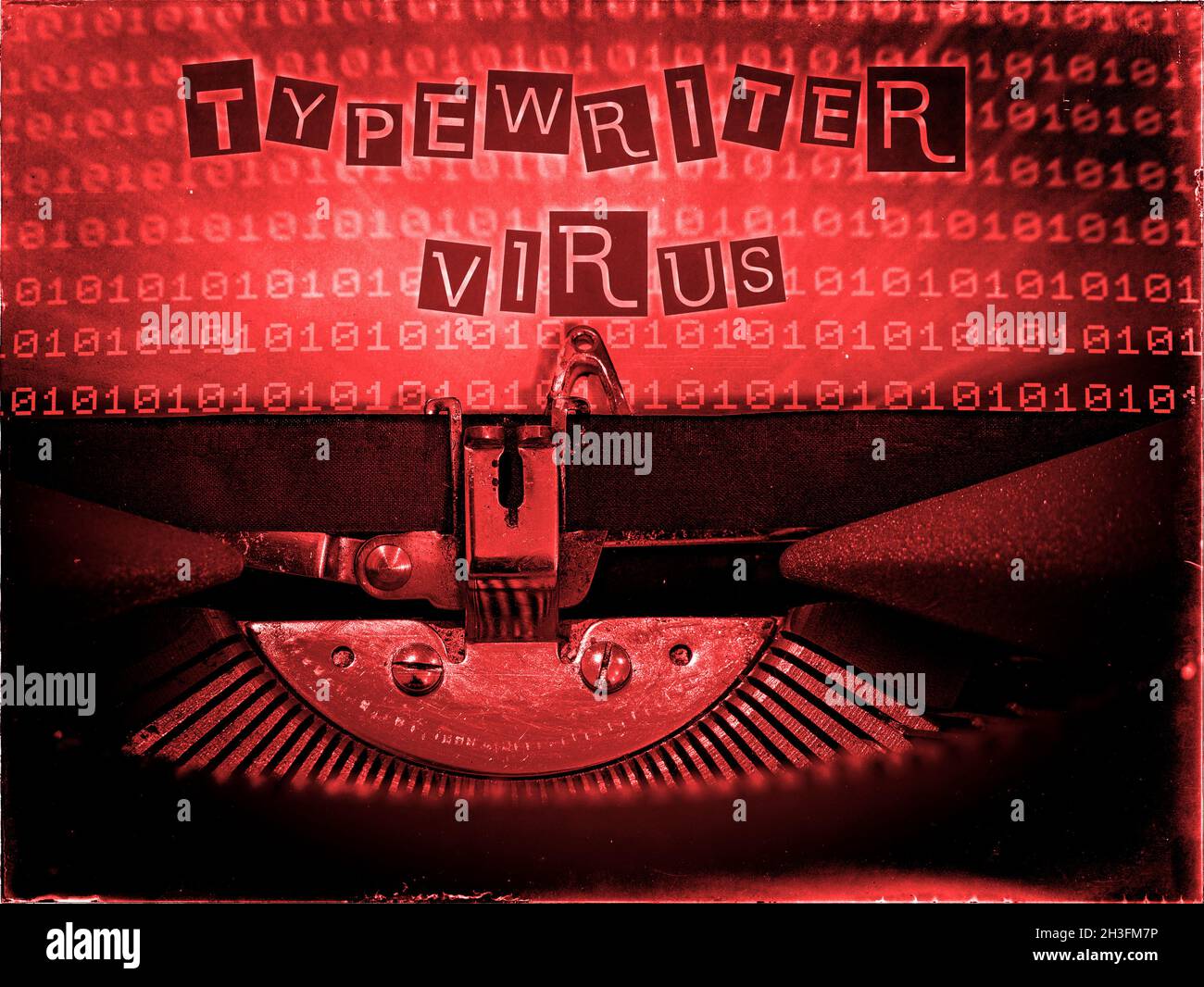 Typewriter Virus displayed on a classic typewriter with a binary code background in a red tone, Retrofuturism Stock Photo