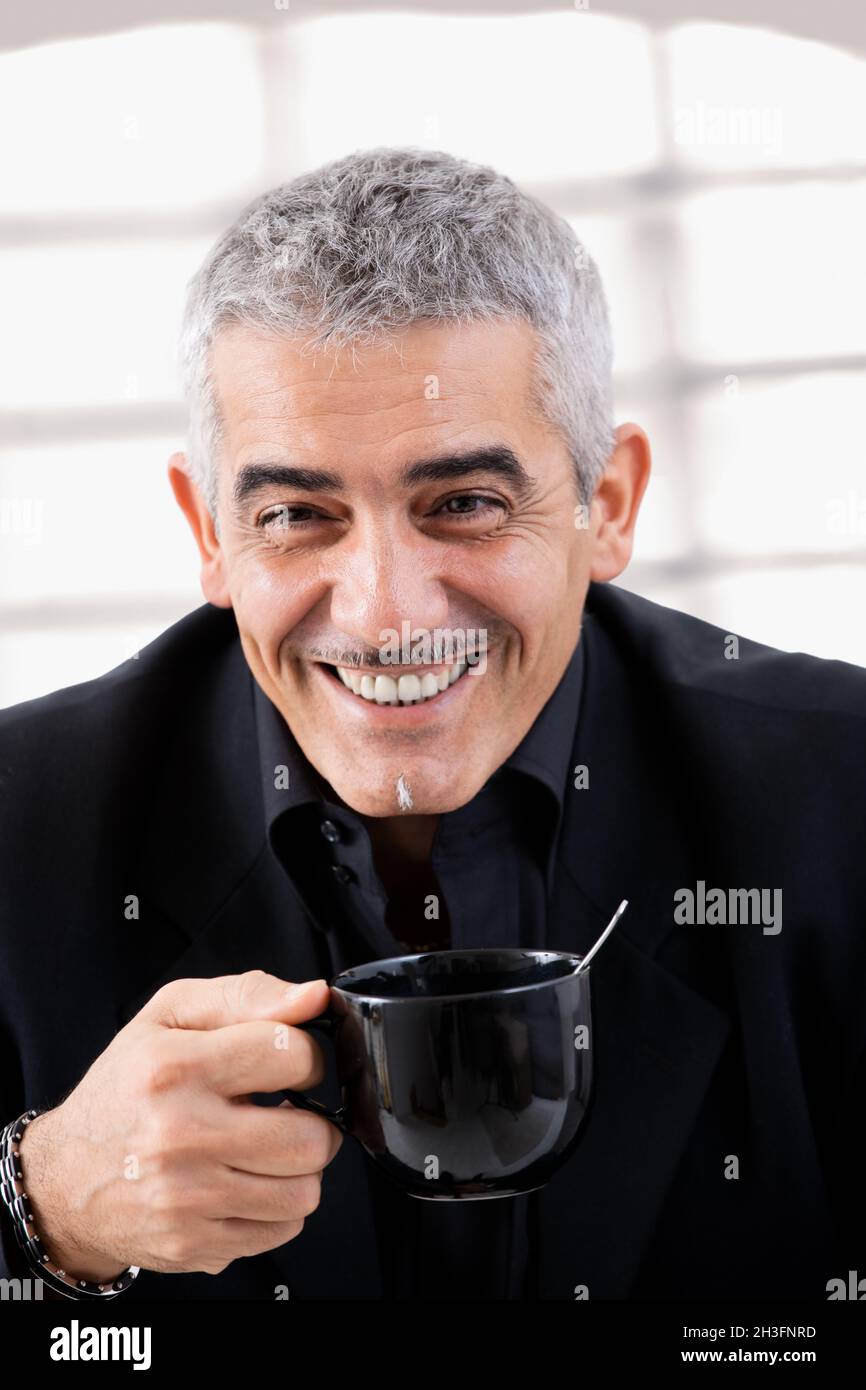 Businessman drinking tea Stock Photo