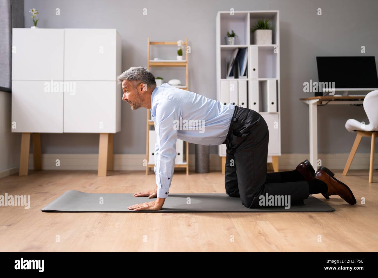 Yoga CatCow Stretch Chakravakasana Stretching Sports Exercise Workout In Office Stock Photo Alamy