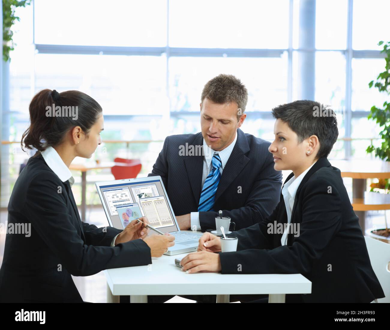 Three Professionals Collaborating Typing three professionals collaborating hi-res stock photography and ...