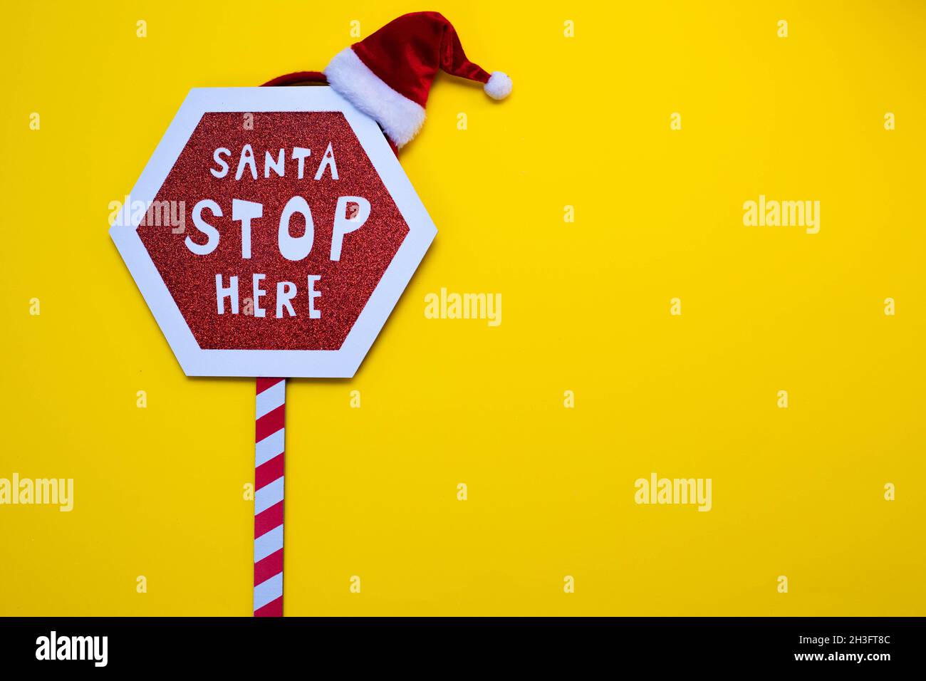 Realistic wooden Christmas Red stop sign with text Santa Stop Here Stock  Photo - Alamy