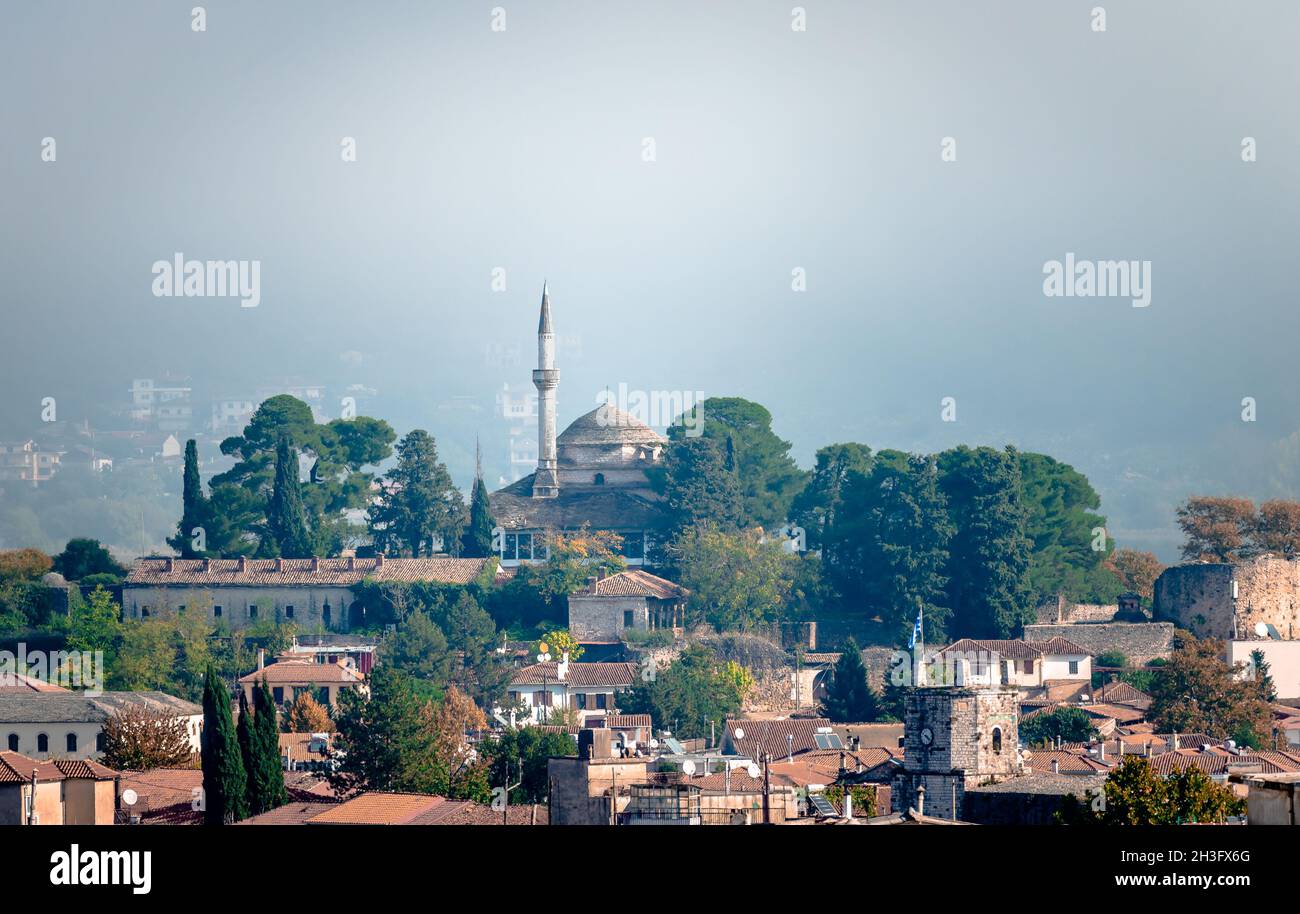 View of the fortified old city of Ioannina, Greece, in a foggy day, with the Alsan Pasha Mosque on top of the hill. Stock Photo