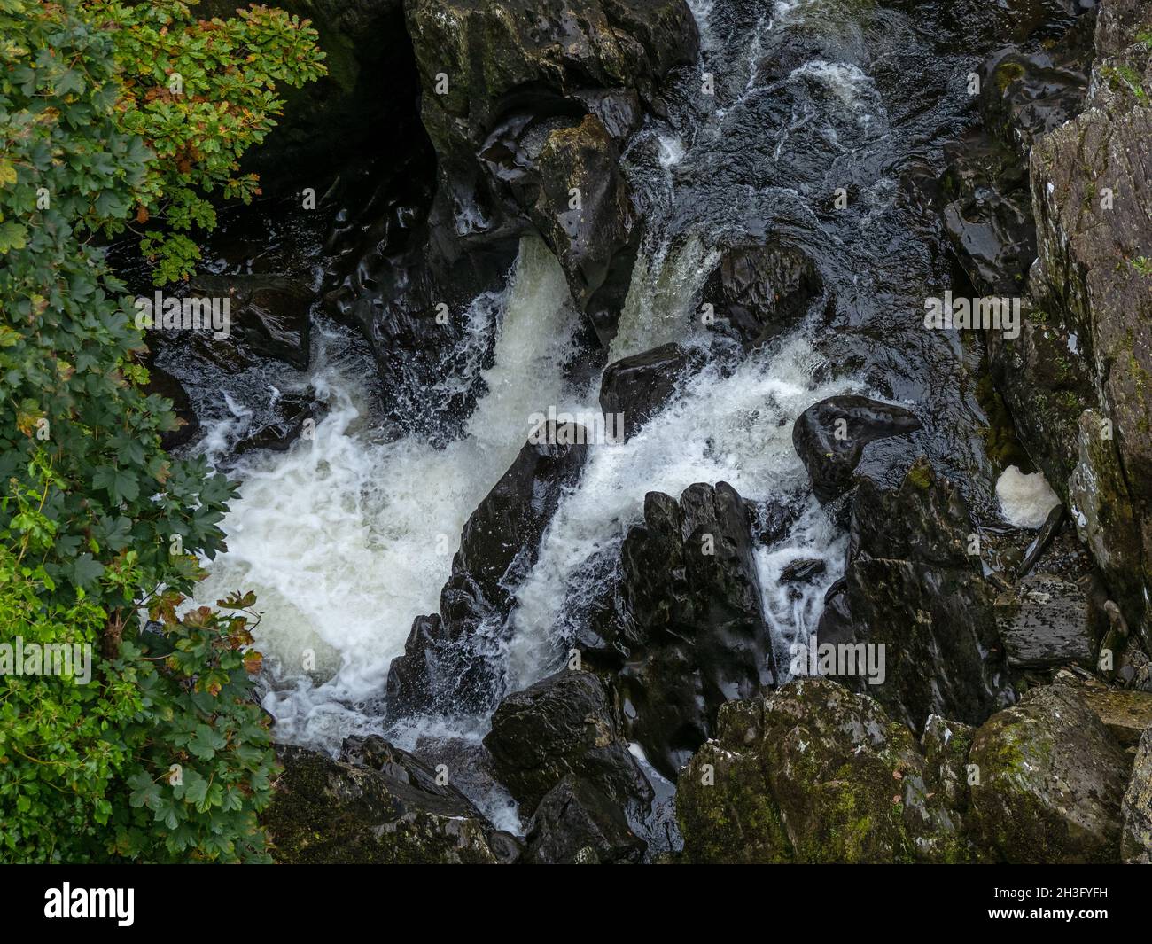 Cyfyng Falls and rocks on the Afon Llugwy between Capel Curig and Betws-y-Coed in Wales. Stock Photo
