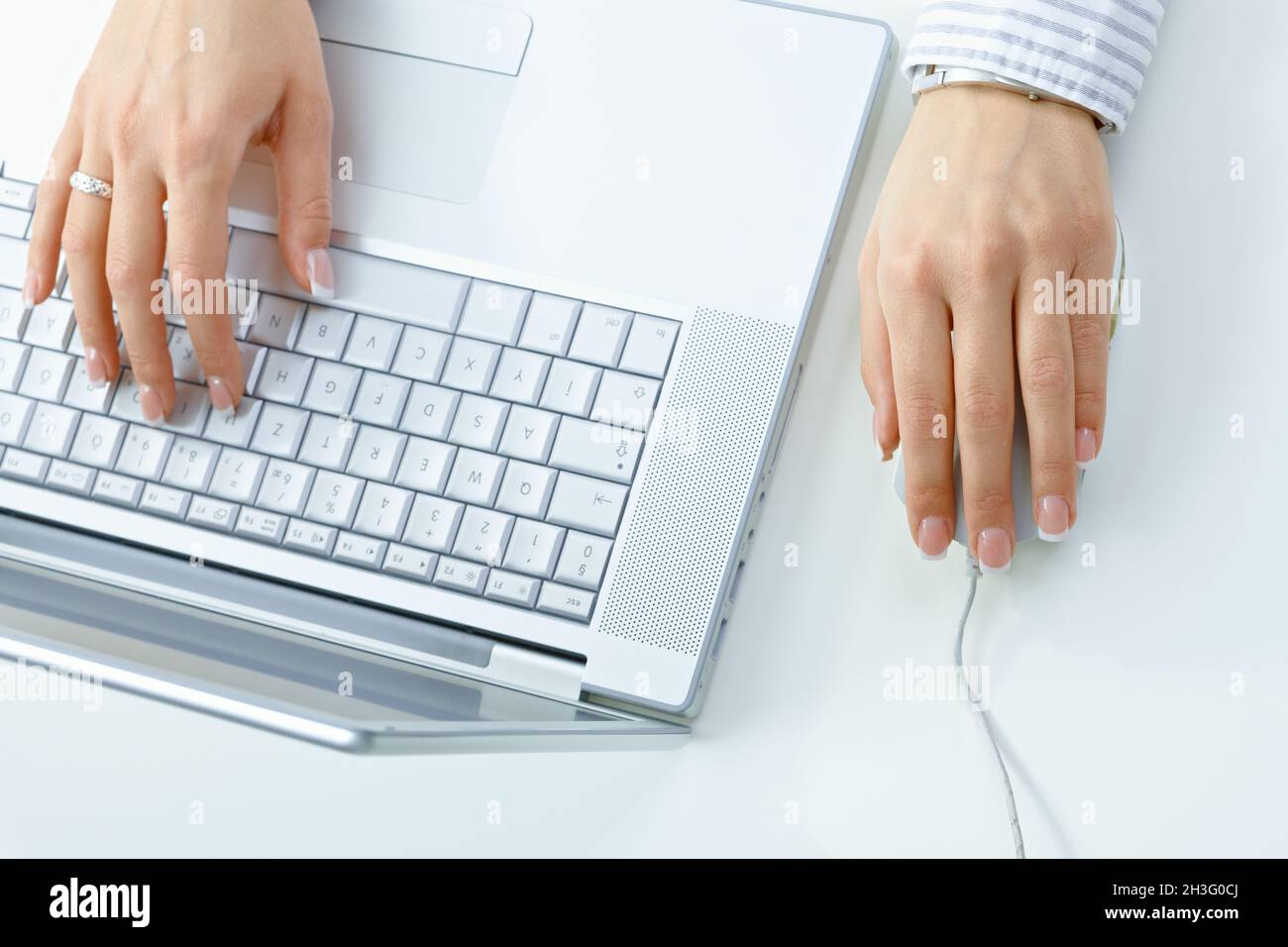 Hands working on computer Stock Photo - Alamy