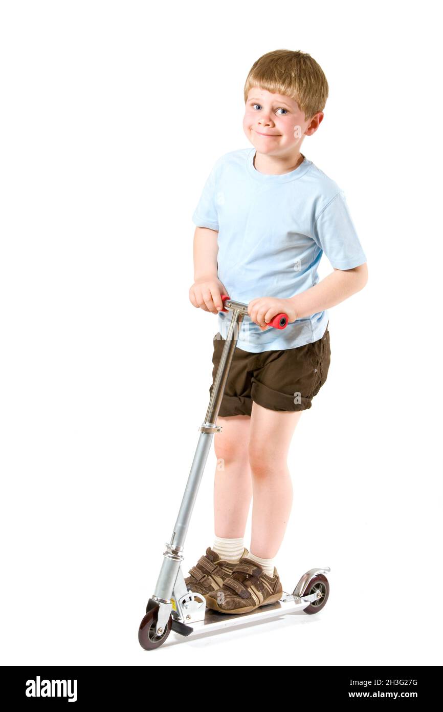 Small boy on scooter Stock Photo - Alamy