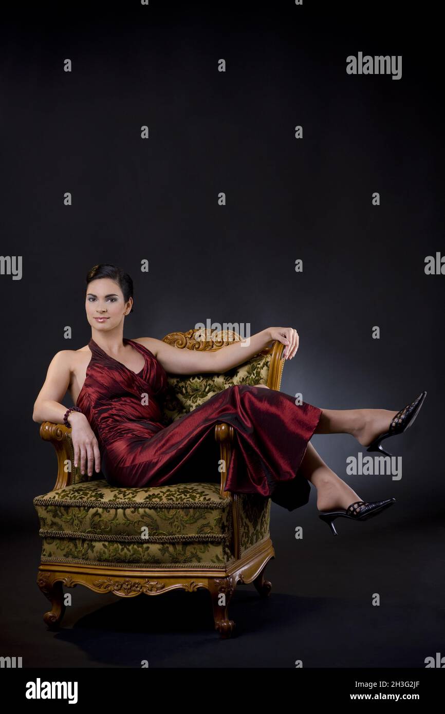 Woman sitting chair full length hi-res stock photography and images - Alamy